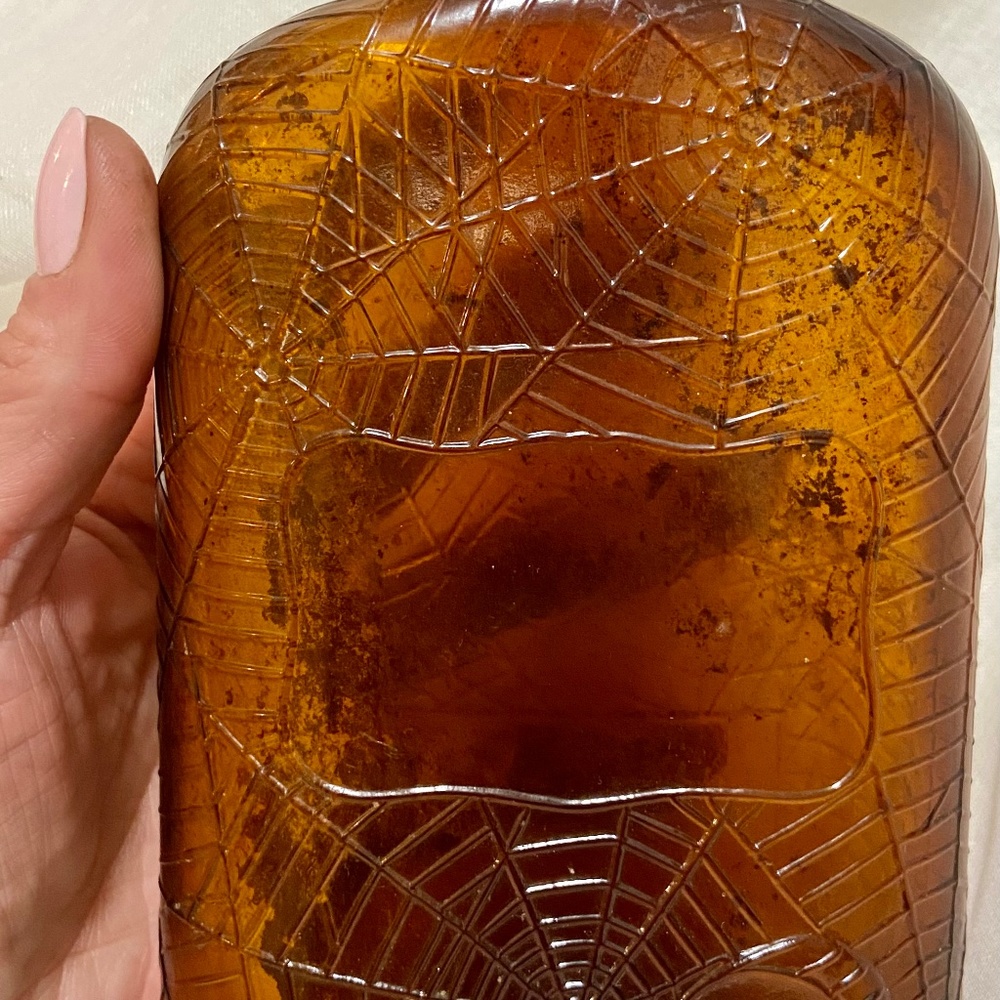 Prohibition era Embossed spider web Whiskey bottle Aged in Wood